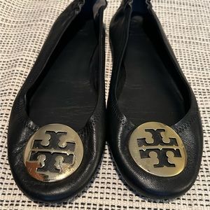 Tory Burch Black Leather Reva Flat Sz 9.5 with gold medallion.  Good used cond